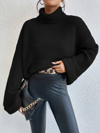 Women's Oversized Waffle Knit Turtleneck Sweater in Black