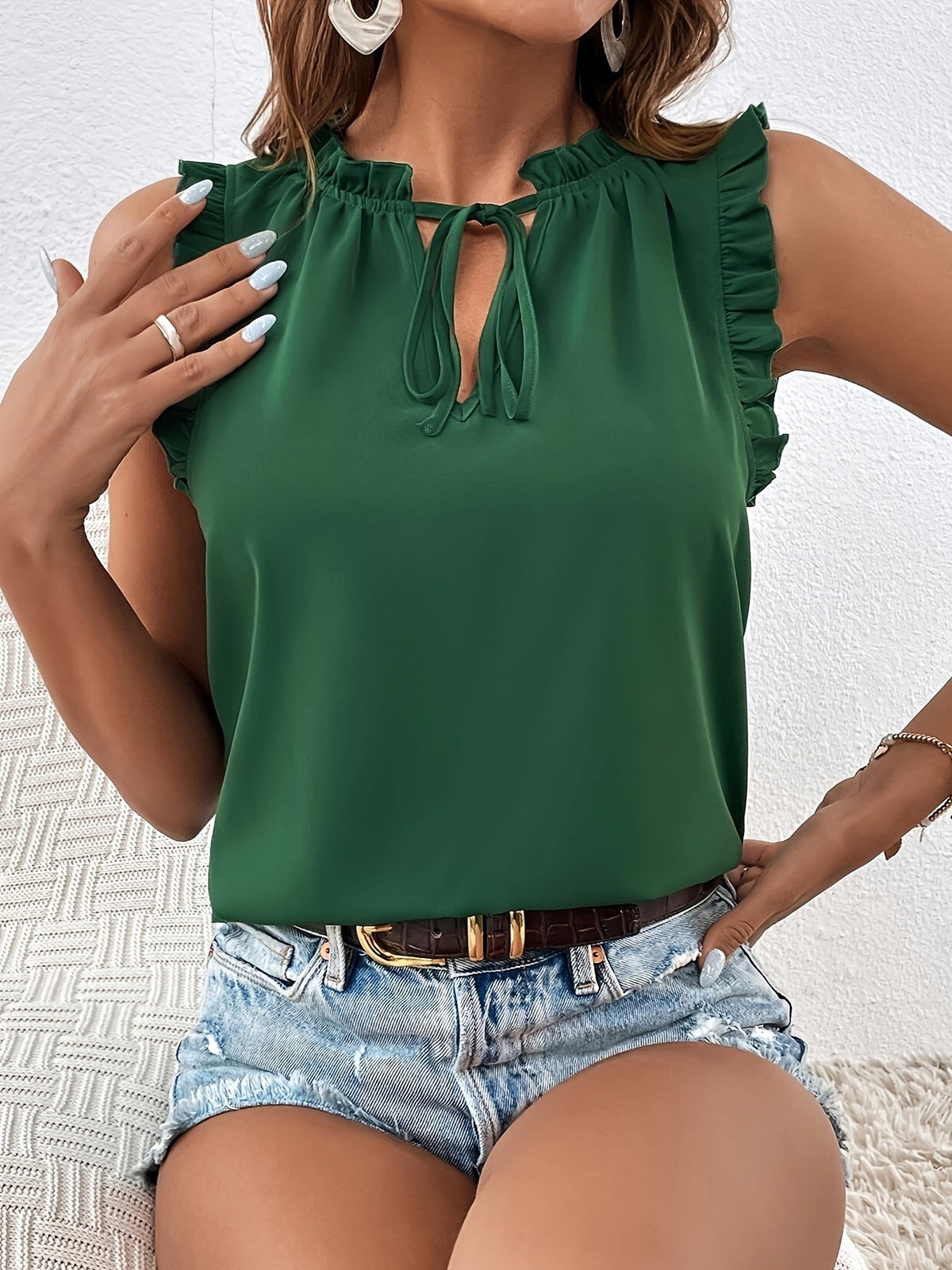 Bella Sleeveless Blouse with Ruffle Shoulders and Tie Neck in Dark Green