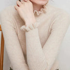 Celia Ribbed Turtleneck Sweater with Ruffled Cuffs in Beige